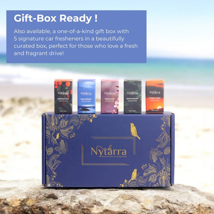 Nytarra gift box featuring five signature car fresheners—Sunshine Zest, Aqua Mirage, Pine Bloom, Rustic Woods, and A Fresh Start—beautifully packaged for a fresh and fragrant drive.