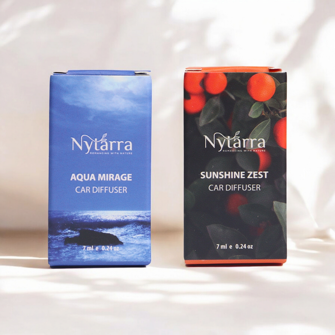Two Nytarra Naturals car diffuser boxes, Aqua Mirage (blue ocean theme) and Sunshine Zest (citrus theme), placed in soft lighting.